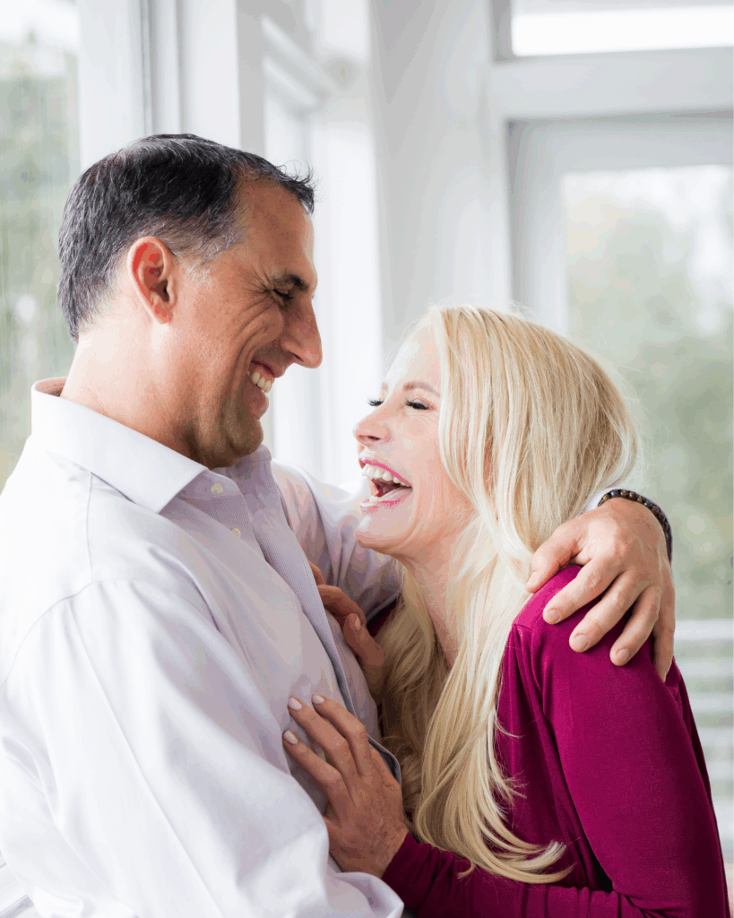 Mia and Michael laughing together, showing authentic love and leadership